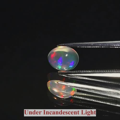 Natural Ethiopian White Opal – 0.89 Ct Oval Cabochon (Floral Rainbow Flash)