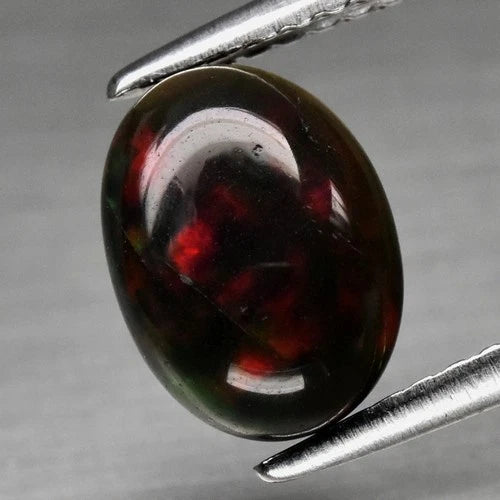 Natural Black Opal - Oval Cabochon - 1.06 ct (8.8 x 6.5 x 3.5 mm)